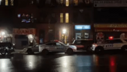 Emergency vehicles respond to incident on wet NYC street