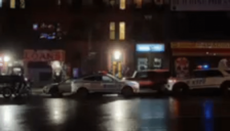 Emergency vehicles respond to incident on wet NYC street