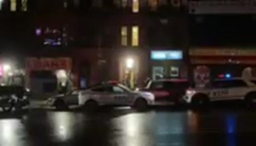 Emergency vehicles respond to incident on wet NYC street