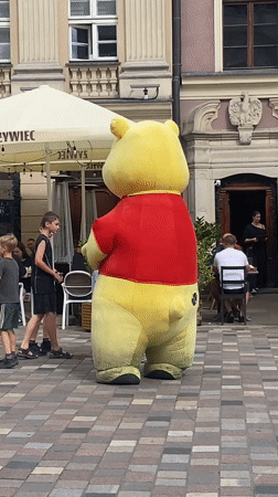 Busy afternoon at Poznań's Old Market Square with mascots and monuments