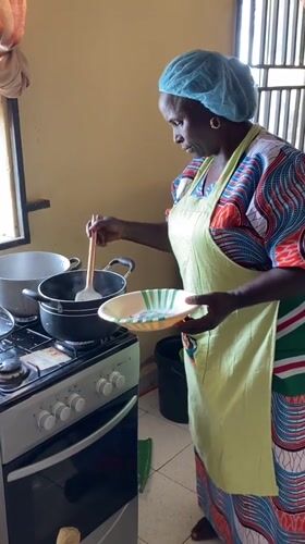 Women in matching aprons prepare food at SKFEST event