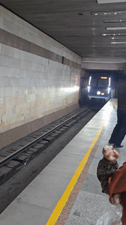 Subway train arrives at Tashkent station platform