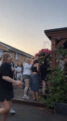 Dancing on a wooden deck at a Guildford gathering