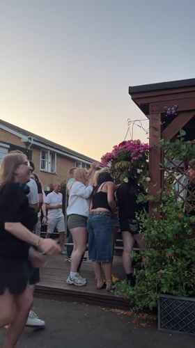 Dancing on a wooden deck at a Guildford gathering