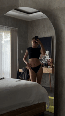 Woman takes bedroom selfie in North Kuta mirror
