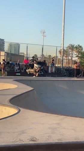 Skateboarder pulls tricks in a Barcelona bowl park
