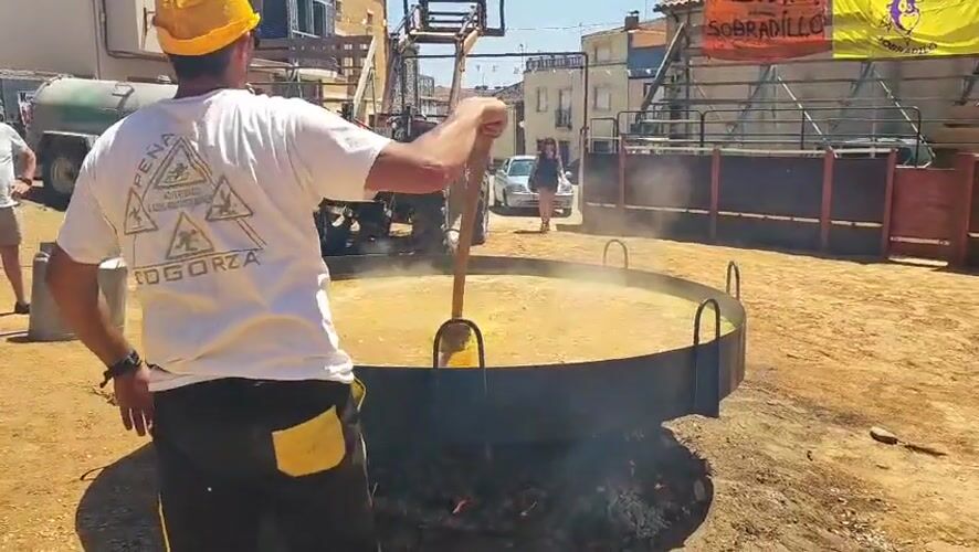 Giant paella cooks over open fire in Sobradillo, Spain
