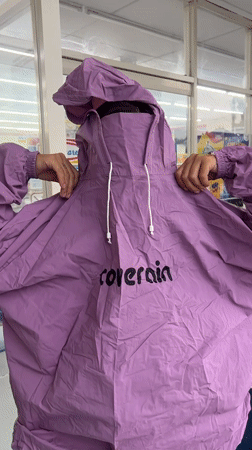 Woman and child shop at convenience store in Mengwi