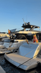 Eivissa marina at golden hour, yachts docked and sun setting