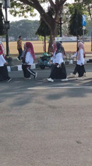 Organized procession and street activity around Purworejo's civic center