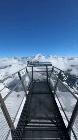 Visitor records alpine panorama from La Clusaz ski resort viewpoint