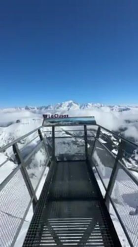 Visitor records alpine panorama from La Clusaz ski resort viewpoint