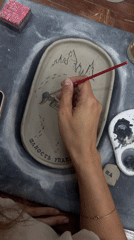 Hand-painted ceramics in progress at a Chaikovsky pottery studio