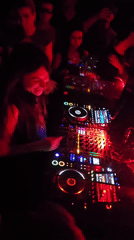 DJ performs at dimly lit Paris club early Saturday morning
