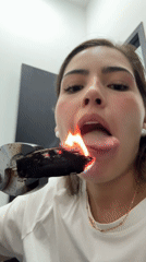 Woman handles burning object with tongs in Mexico