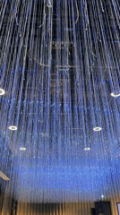 Artistic installation with hanging white strands documented in Riga