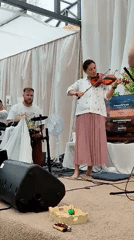 Musical gathering with dancing under tent in Zhirnosovo, Russia