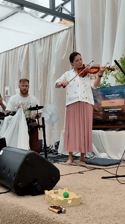 Musical gathering with dancing under tent in Zhirnosovo, Russia