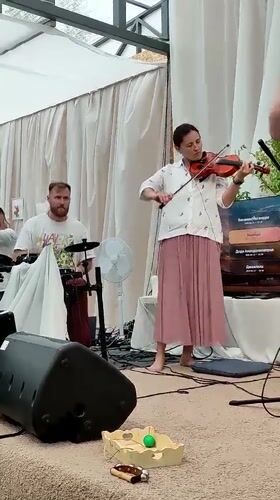 Musical gathering with dancing under tent in Zhirnosovo, Russia