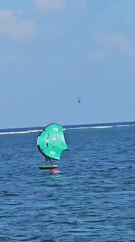 Kitesurfing and wing foiling session on a Bali beach morning