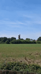 Historic stone tower documented from multiple viewpoints in Tortona