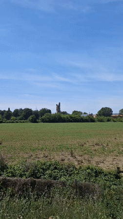 Historic stone tower documented from multiple viewpoints in Tortona