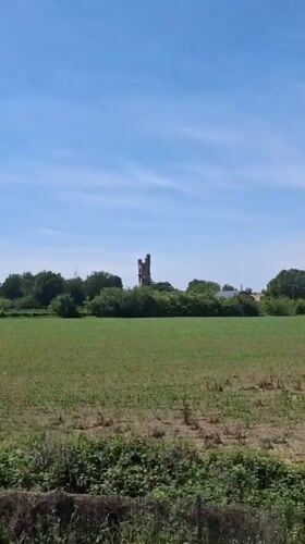 Historic stone tower documented from multiple viewpoints in Tortona