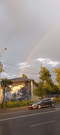 Rainbow over Almaty streets, July 2026