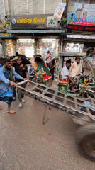 Busy street scenes and vendor activity in central Dhaka