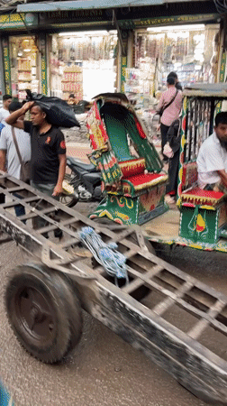 Busy street scenes and vendor activity in central Dhaka