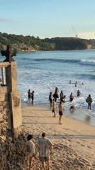 Beach crowds and cultural shrine captured in Kuta Selatan