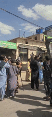 Crowds gather in busy Kuchlak market district during daytime