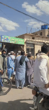 Crowds gather in busy Kuchlak market district during daytime