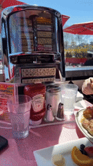 Patrons use vintage jukebox at NYC retro diner