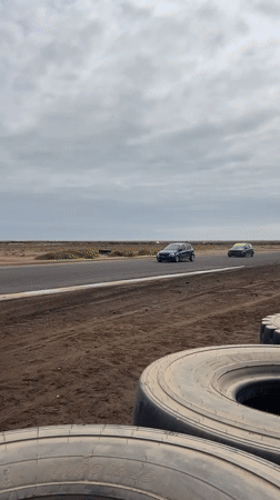 Two cars race on closed track in Arica