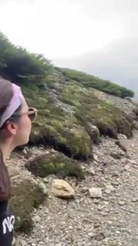 Hiker spotted on trail overlooking Ushuaia and Beagle Channel