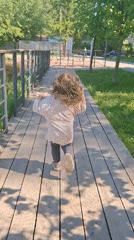 Child plays in Saint Petersburg park during morning hour
