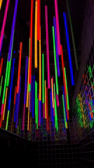 Colorful neon tube display captured in darkened Moscow room
