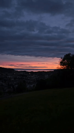 Dramatic sunset captured over St. Gallen cityscape and countryside