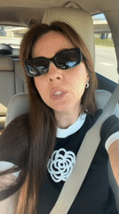Woman in decorated black shirt observed in car, Riga