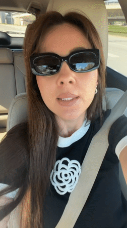 Woman in decorated black shirt observed in car, Riga