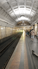 Moscow Metro passengers and historic sculptures documented during midday commute
