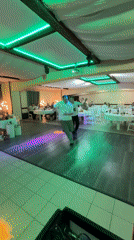 Men dance together at wedding reception in Chaikovsky, Russia