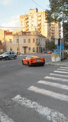 Evening scenes captured across Belgrade include sports car, church, cafe