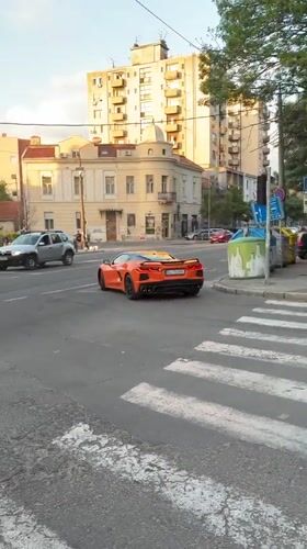 Evening scenes captured across Belgrade include sports car, church, cafe