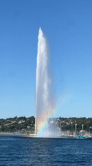 Geneva's Jet d'Eau catches a rainbow in its mist