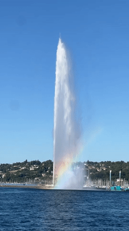 Geneva's Jet d'Eau catches a rainbow in its mist