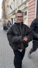 Woman walks Saint Petersburg streets while checking phone