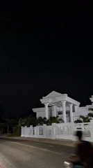 Illuminated white building observed at night in Lancang Barat