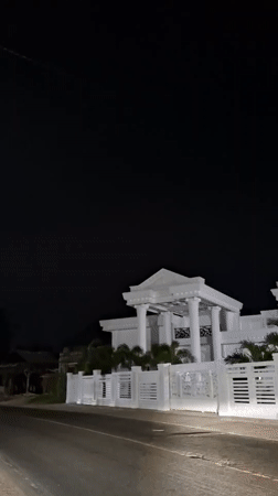 Illuminated white building observed at night in Lancang Barat